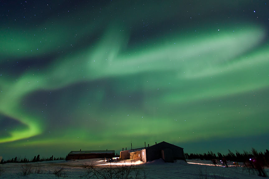 Northern lights (aurora borealis) over Watchee Lodge in northern Manitoba
