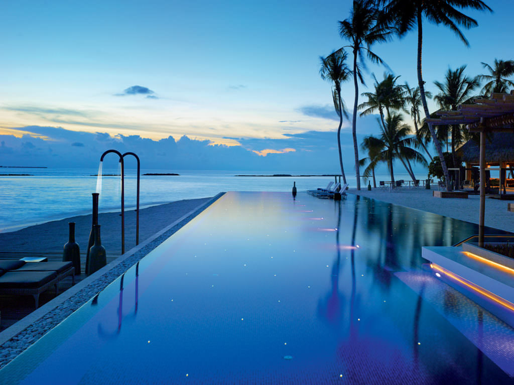 Velaa Private Island Maldives - Avi Pool Bar - Sunset View over Lagoon Velaa Private Island Maldives - Avi Pool Bar - Sunset View over Lagoon