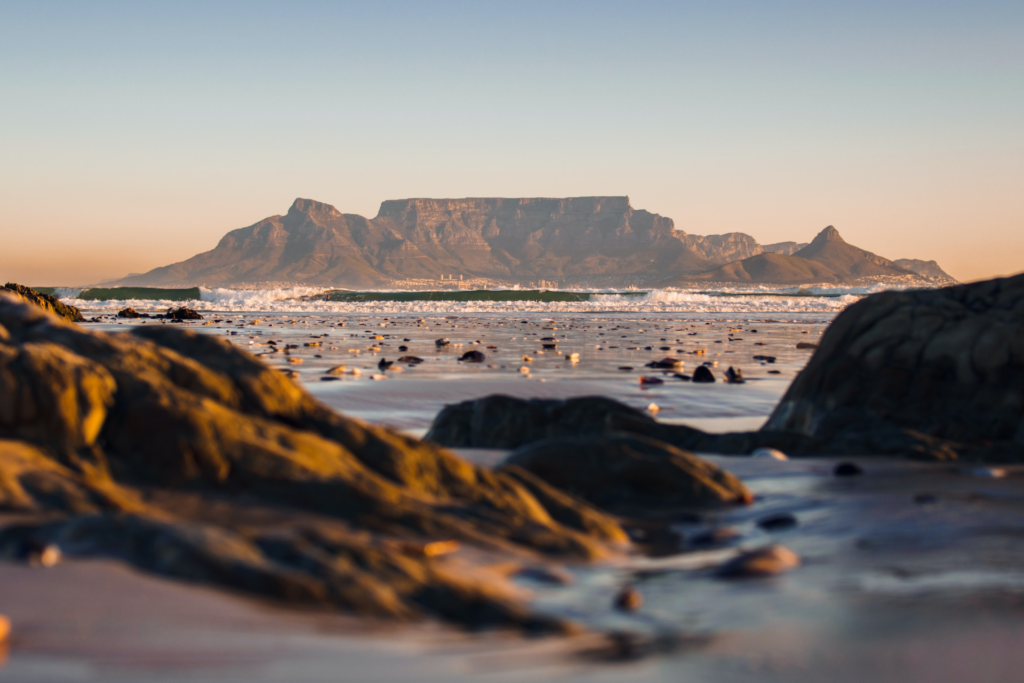Table Mountain viewed from the Cape Town coastline at sunset, one of the city's most iconic landmarks