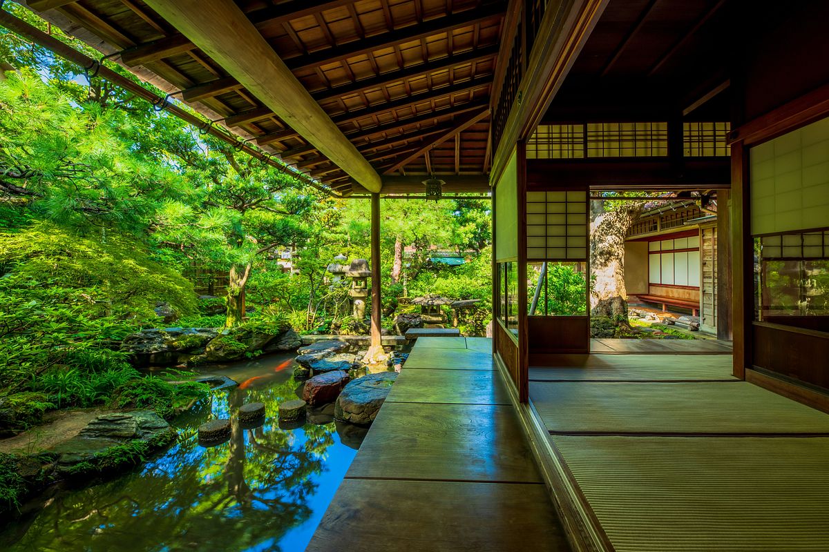 Tatami veranda overlooking a koi pond and moss garden at the Nomura Samurai House in Kanazawa’s Nagamachi district